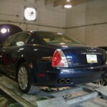 Before and after photographs of a damaged, blue, Maserati that was repaired by Elite Paint & Body Shop in West Palm Beach, FL.